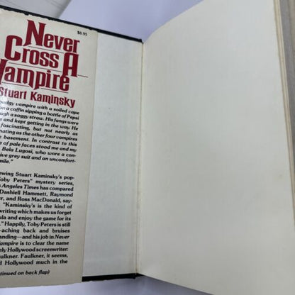 FIRST EDITION, A TOBY PETERS MYSTERY NEVER CROSS A VAMPIRE STUART KAMINSKY